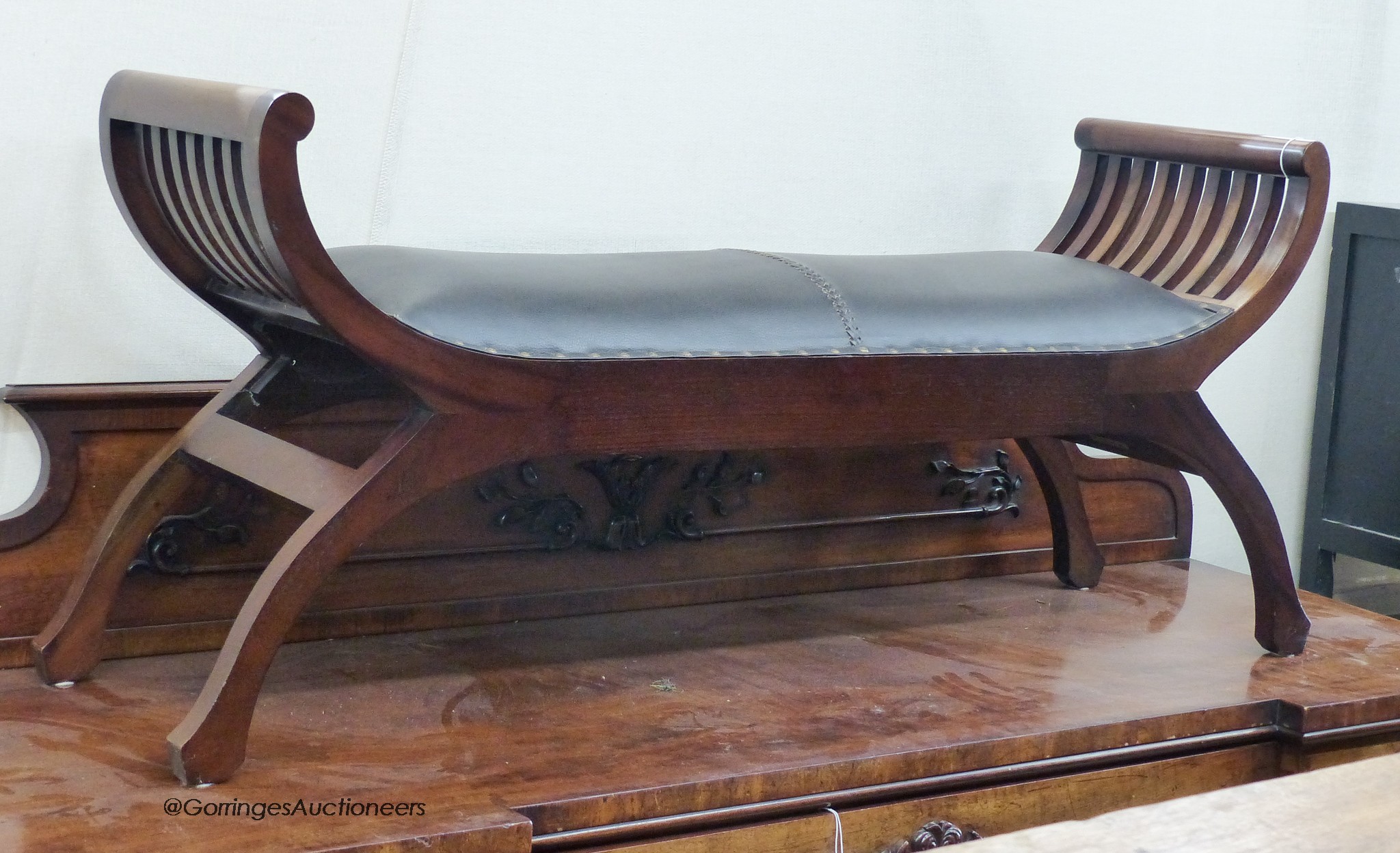 A reproduction mahogany window seat. W-138, D-36, H-58cm.